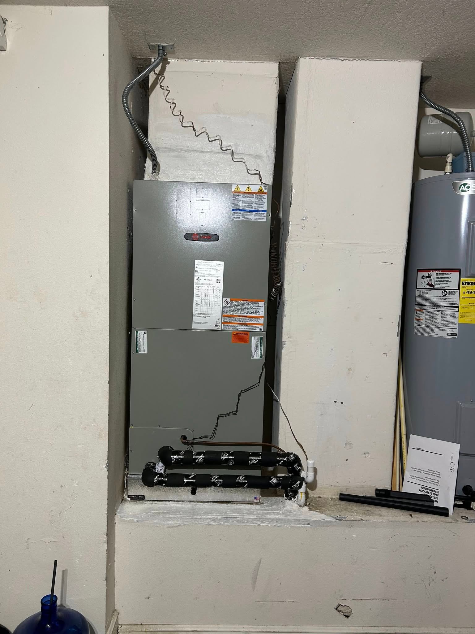 Trane air handler installed in utility closet