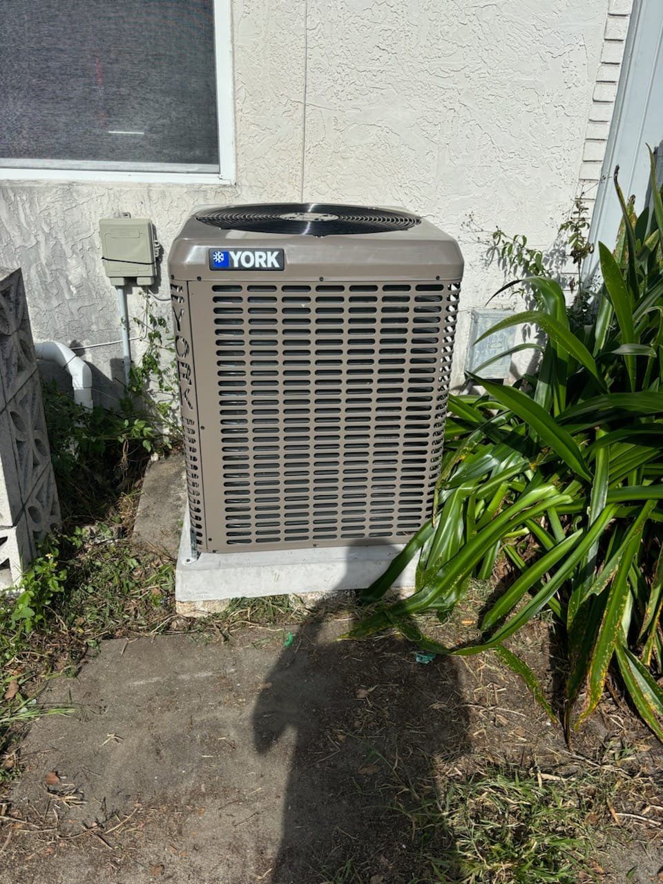 Trane air handler installed in garage with ductwork